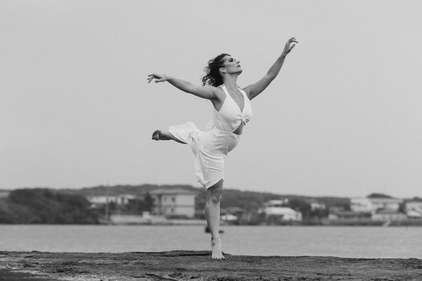 A person moving gracefully through a yoga sequence.