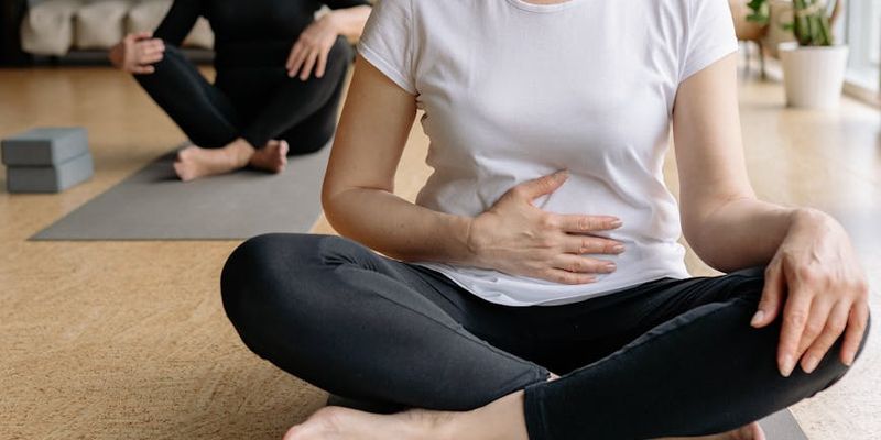 Person in a deep stretching pose, showing flexibility.